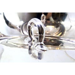 Silver casserole with open knob on the smooth, grooved lid, wooden handle