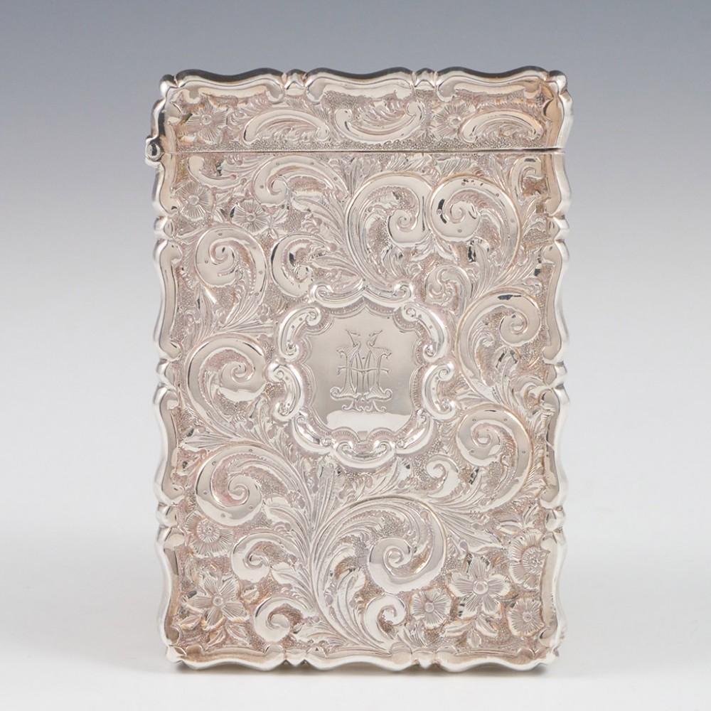 Heading : George Unite castle top card case
Date : Hallmarked in Birmingham in 1866 for George Unite
Period : Vicotoria
Origin : Birmingham, England
Decoration : Raised depiction of Windsor Castle with a background of repousse and chased acanthus