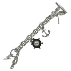 Silver chain bracelet with charms