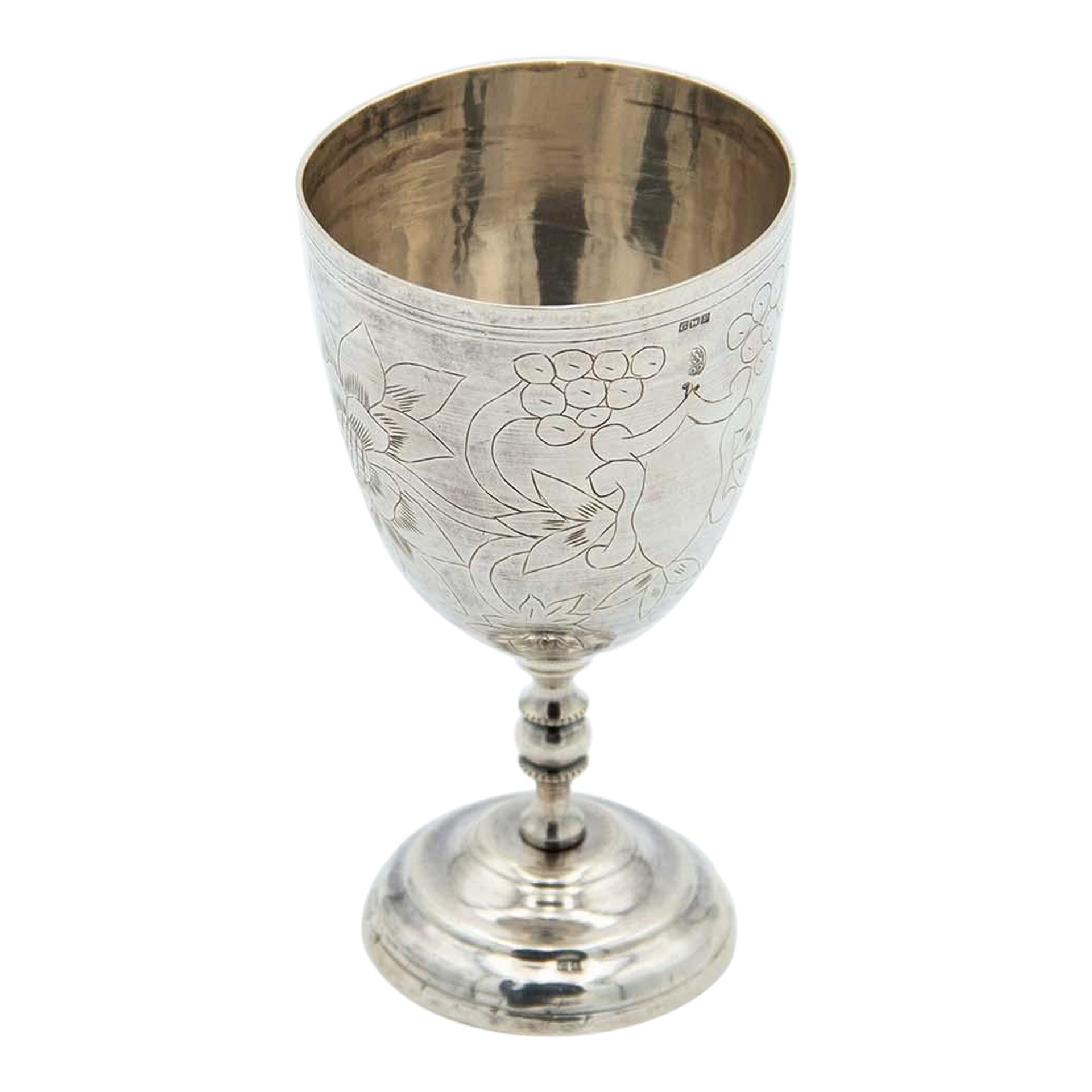 Silver chalice w/ a circular base
floral motifs engraved in the Arabic style