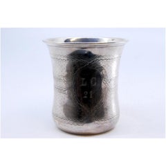 Silver chalice with engravings all around and monogram card