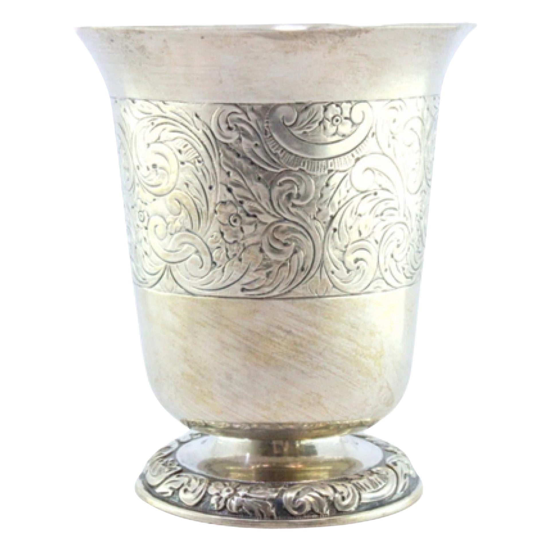 Silver chalice with engravings and raised base with floral motifs