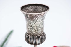 Silver chalice with fluted reliefs, floral engravings and raised base