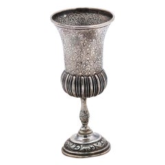Silver chalice with fluted reliefs, floral engravings and raised base