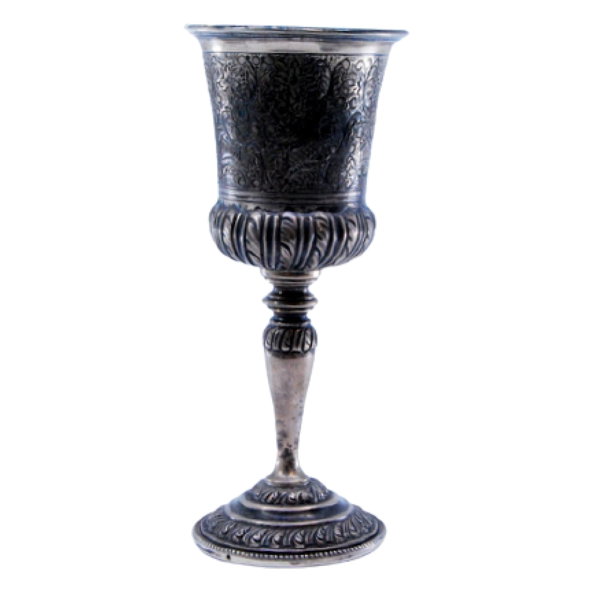 Silver chalice with reliefs on the round base and gold on the inside