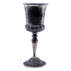 Silver chalice with reliefs on the round base and gold on the inside