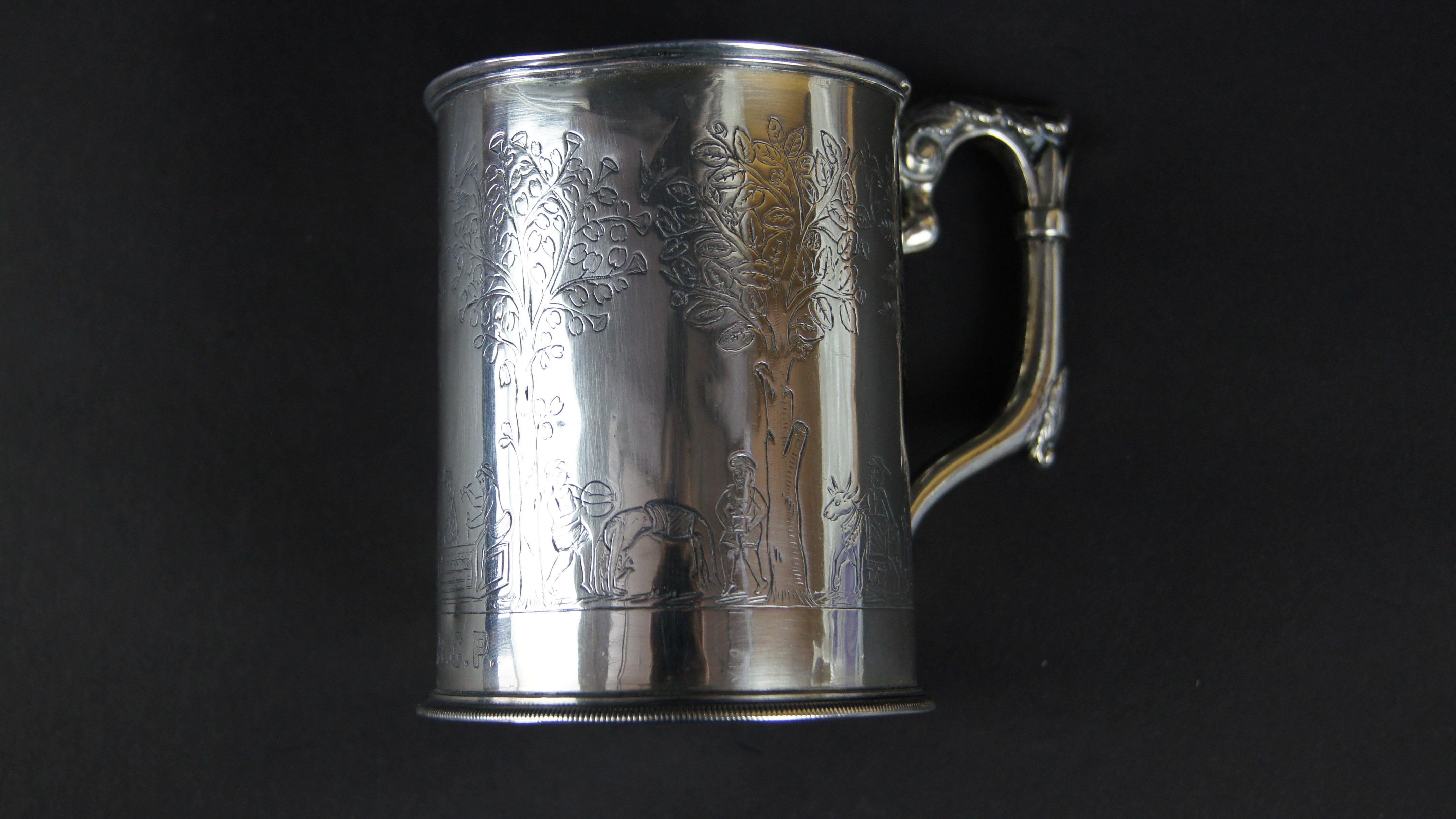 A British colonial silver christening mug by Peter Nicholas Orr, Madras, India, circa 1860. With an acanthus leaf capped handle, engraved with village life scenes, engraved with initials E.B.C.P., underneath stamped ORR, 5oz.