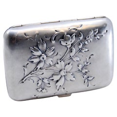 Silver cigarette case in Art Nouveau style with embossed floral motifs