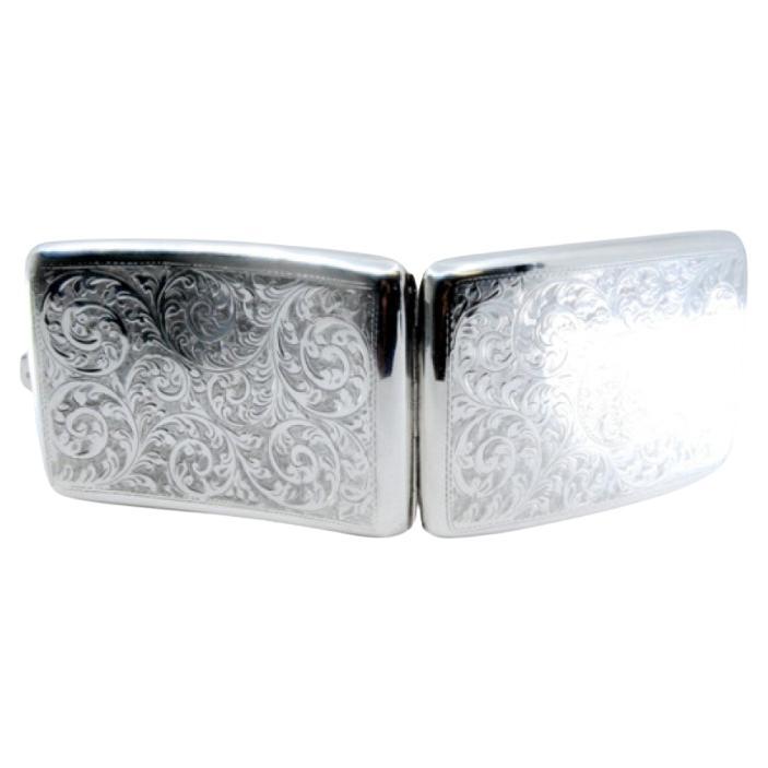 Silver cigarette case w/ curved engravings 
a gold interior w/ a hinged lid For Sale