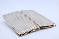 Silver cigarette case w/ fluted bands on both sides, gold interior & hinged lid