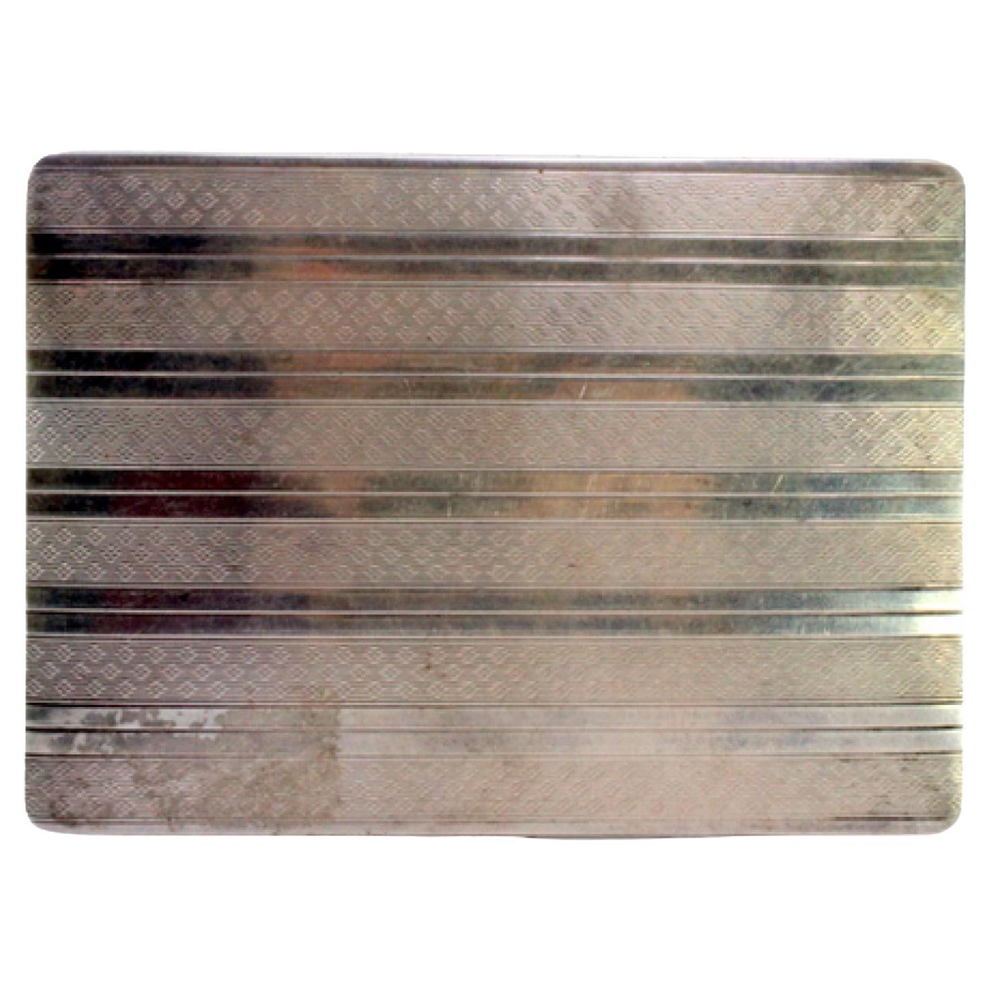 Silver cigarette case w/ guilloche bands at the top, gold interior & hinged lid