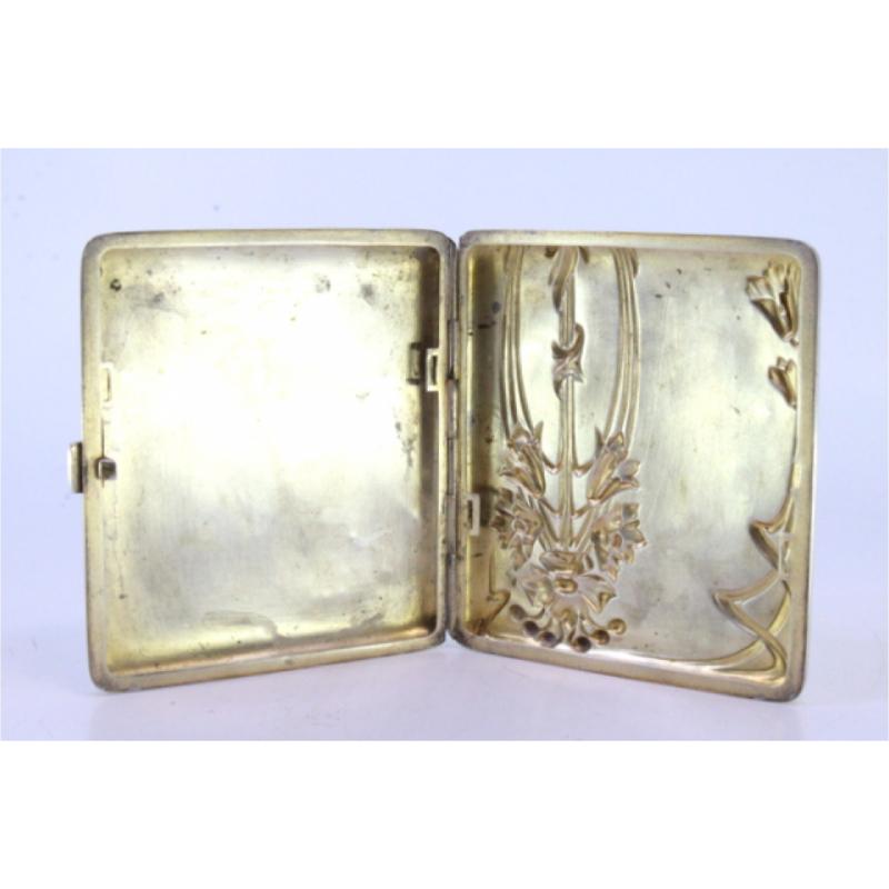 Description: Silver cigarette case with Art Nouveau floral reliefs and hinged lid. Metal: Silver. Origin: European. Brand: Unknown. Weight: 90.22 grams. Dimensions: 9cmx8cm. Content: 800/1000. Assay Mark: Yes. Additional information: Good condition.