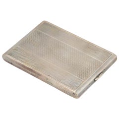 Silver cigarette case with asymmetrical patterns