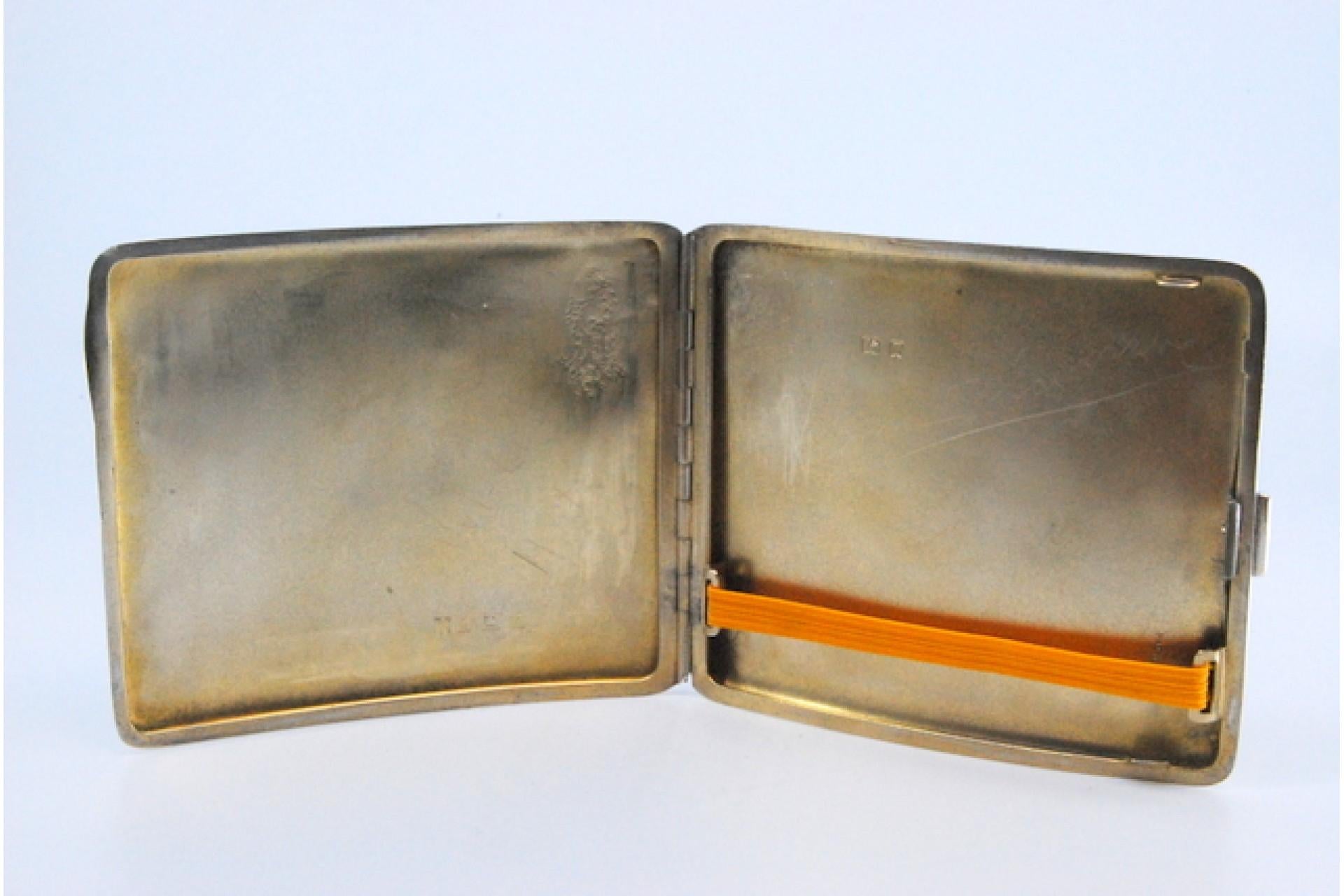 Description: Silver cigarette case with curved guilloche bands at the top and hinged lid. Metal: Silver. Origin: English. Brand: Birmingham. Weight: 100.14 grams. Dimensions: 7.5x9cm. Content: 925/1000. Assay Mark: Yes, 1850 by William Neadle & Son.