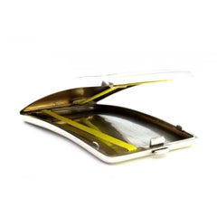 Silver cigarette case with curved guilloche bands at the top