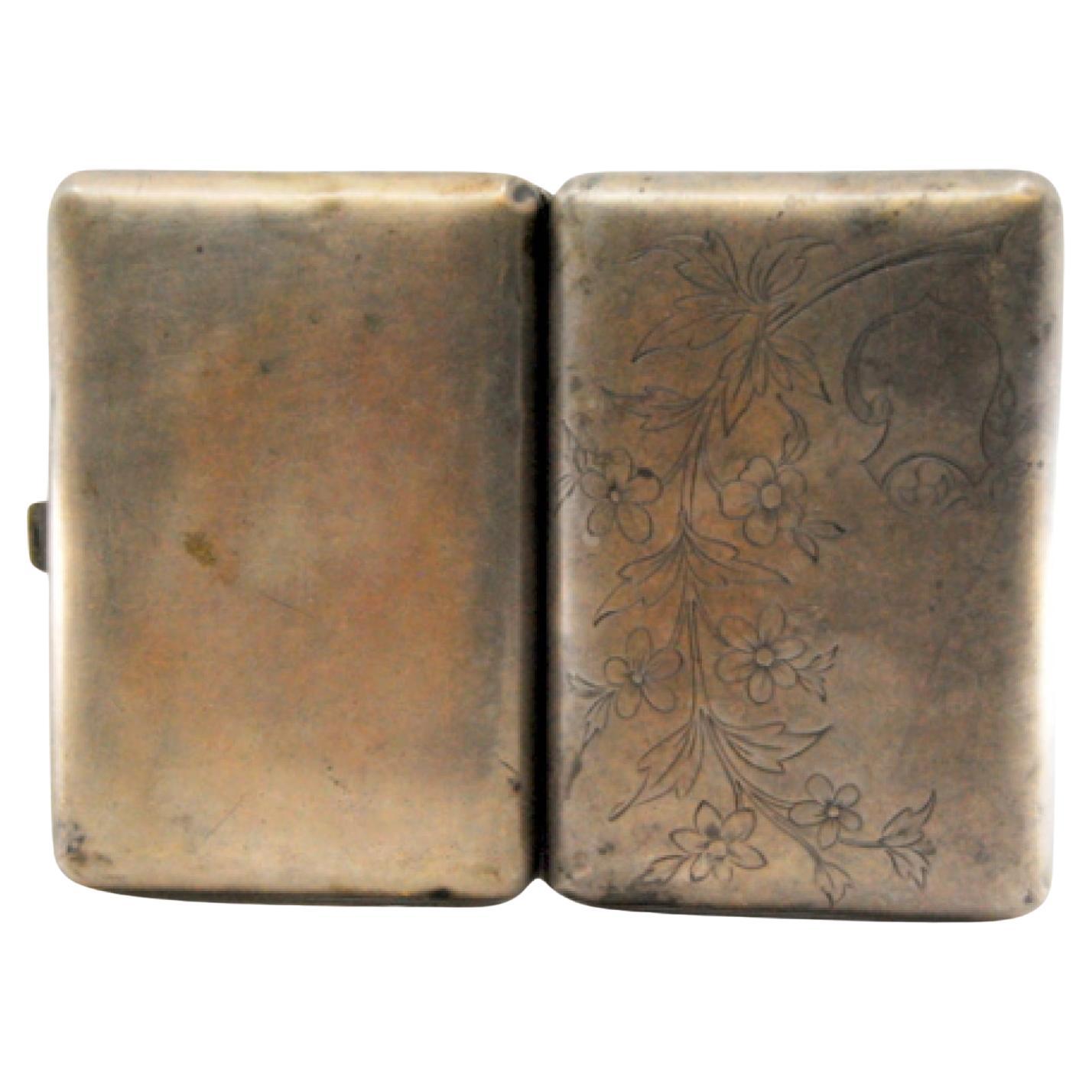 Silver cigarette case with engraved branches and hinged lid