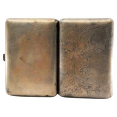 Silver cigarette case with engraved branches and hinged lid