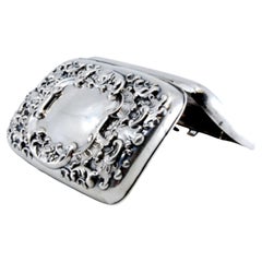 Silver cigarette case with engravings, cigarette holders inside and hinged lid