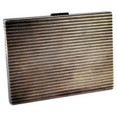 Silver cigarette case with fluted bands and hinged lid