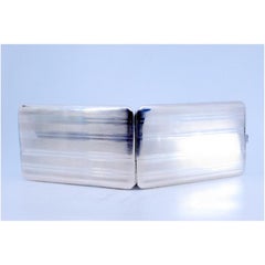 Silver cigarette case with guilloche bands along the length and hinged lid