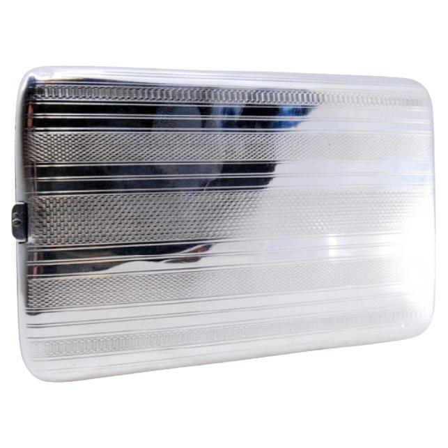 Silver cigarette case with guilloche bands along the length and hinged lid
