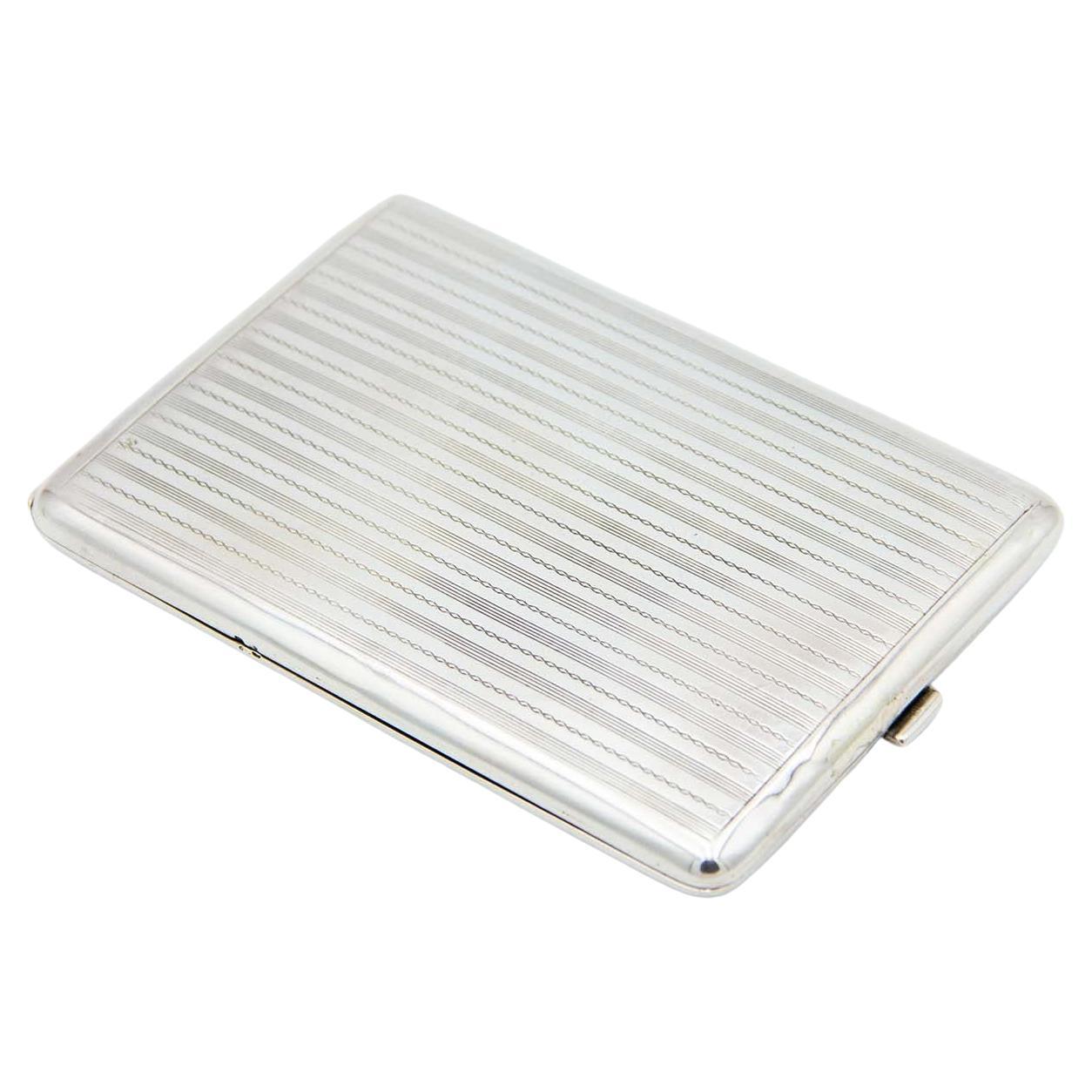 Silver cigarette case with guilloche bands along the length