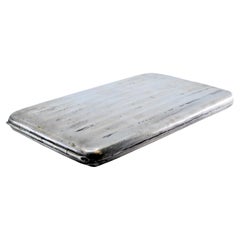 Silver cigarette case with guilloche bands and gold interior