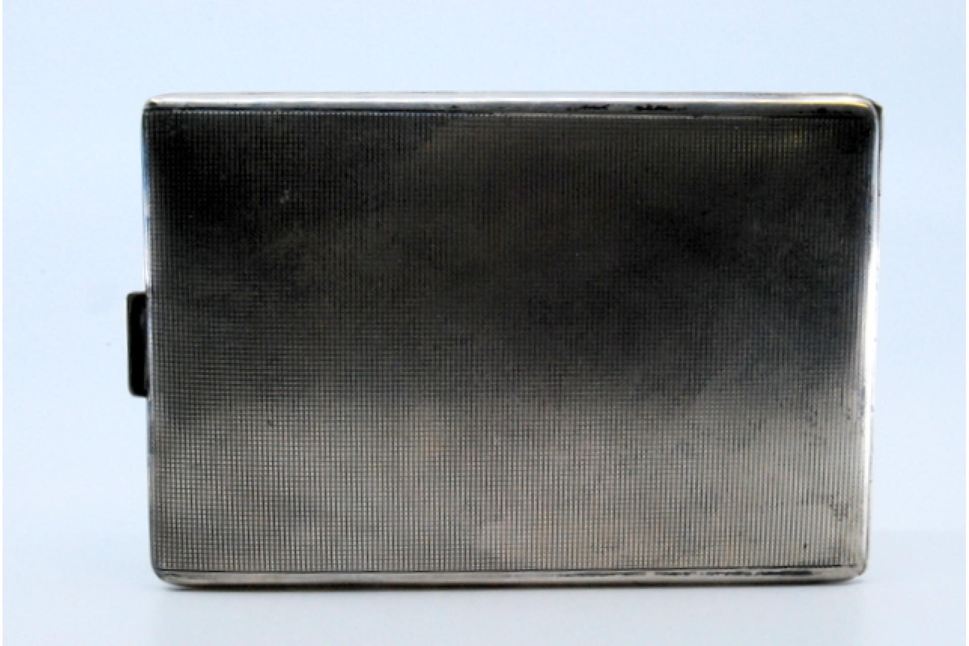 Description: Silver cigarette case with guilloche bands at the top and hinged lid. Metal: Silver. Origin: European. Mark: Absent. Weight: 115.02 grams. Dimensions: 12x0.7cm. Content: 835/1000. Assay Mark: Absent. Additional information: Good