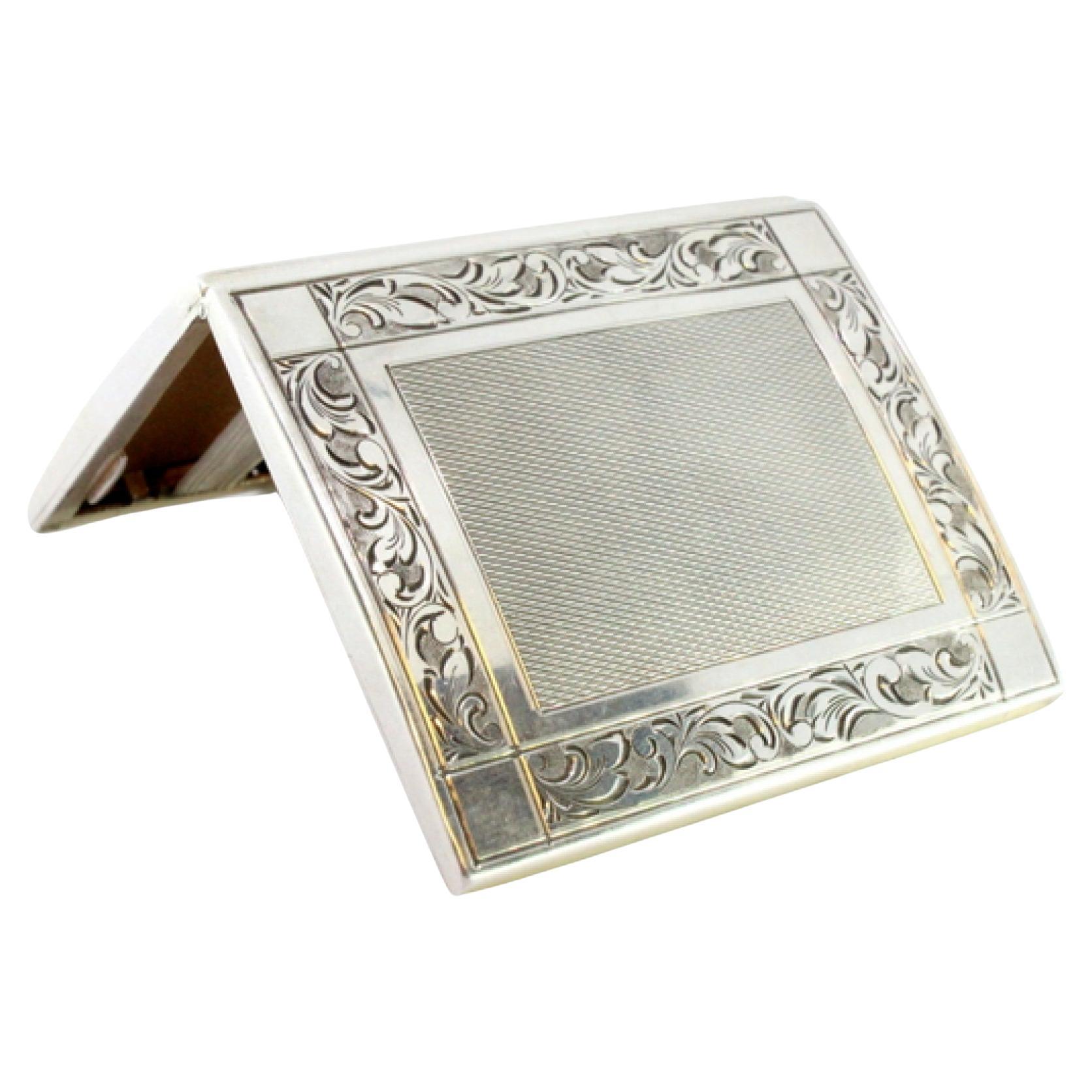 Silver cigarette case with reliefs, brushed silver lid and base trims