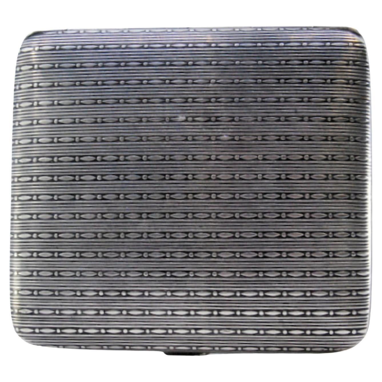 Silver cigarette case with square-shaped chiseled reliefs and a hinged lid For Sale