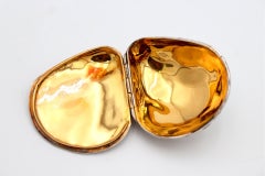 Silver clam with reliefs and applications