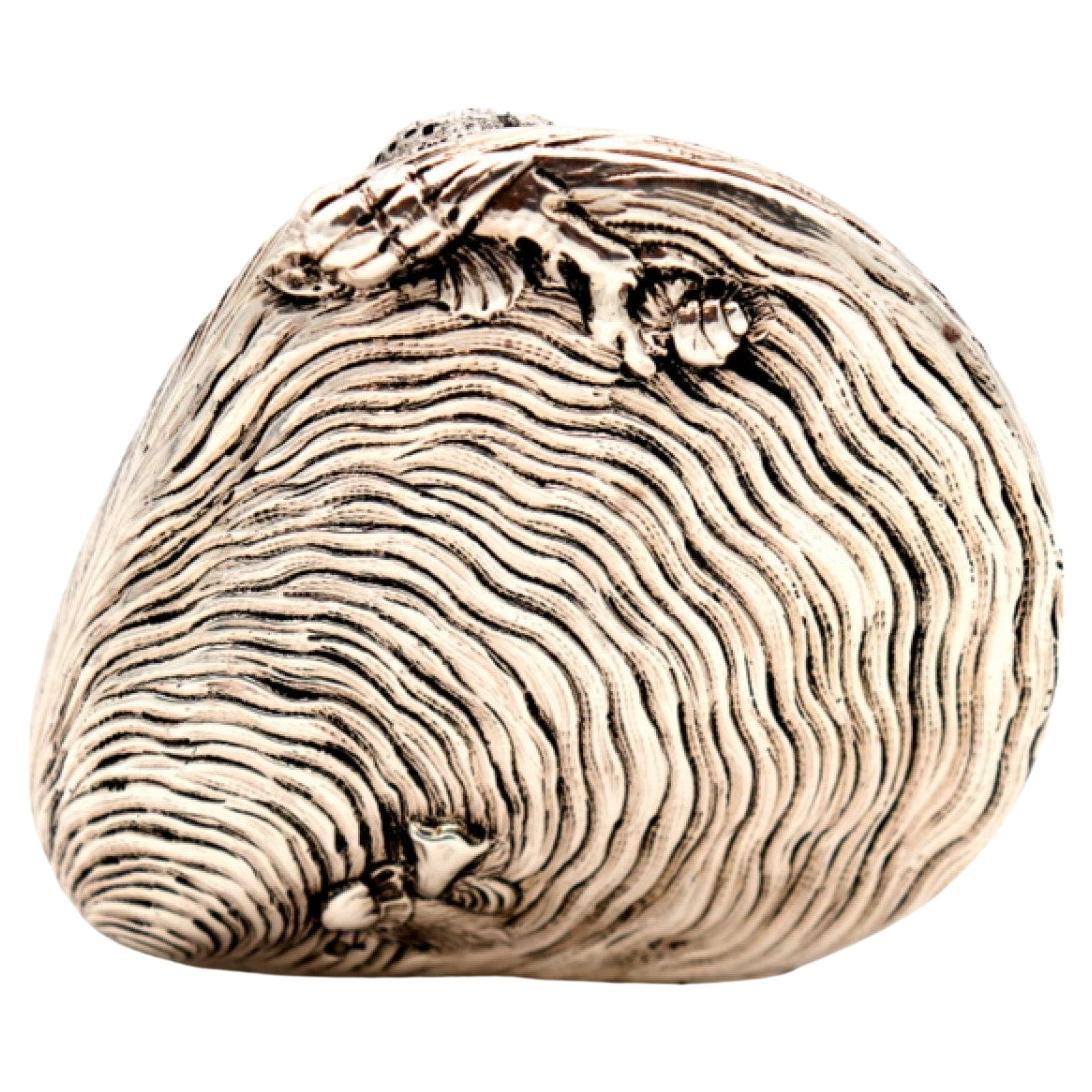 Silver clam with reliefs and applications