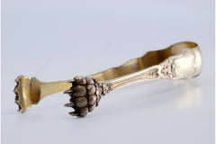 Silver claw-shaped ice tongs