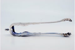 Silver claw-shaped ice tongs