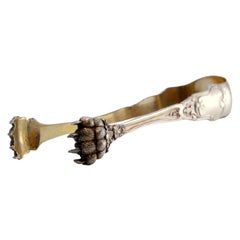 Silver claw-shaped ice tongs