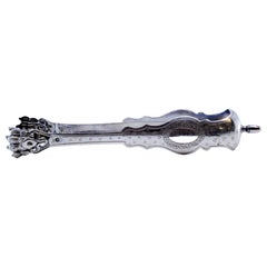 Silver claw-shaped ice tongs