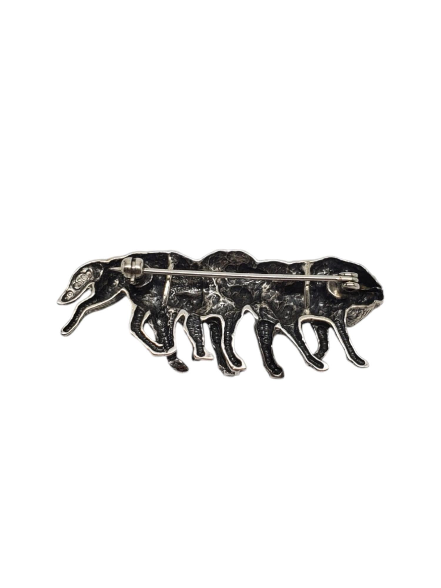 Silver Cloud Sterling Silver Wolf Pack Pin-

This wolf pin by Silver Cloud is intricately crafted in sterling silver.

Size: 2 in. x 0.7 in.

Stamped: SC STERLING

Weight: 9.1 dwt. / 14.2 gr.

Very good condition, professionally polished.

Will come
