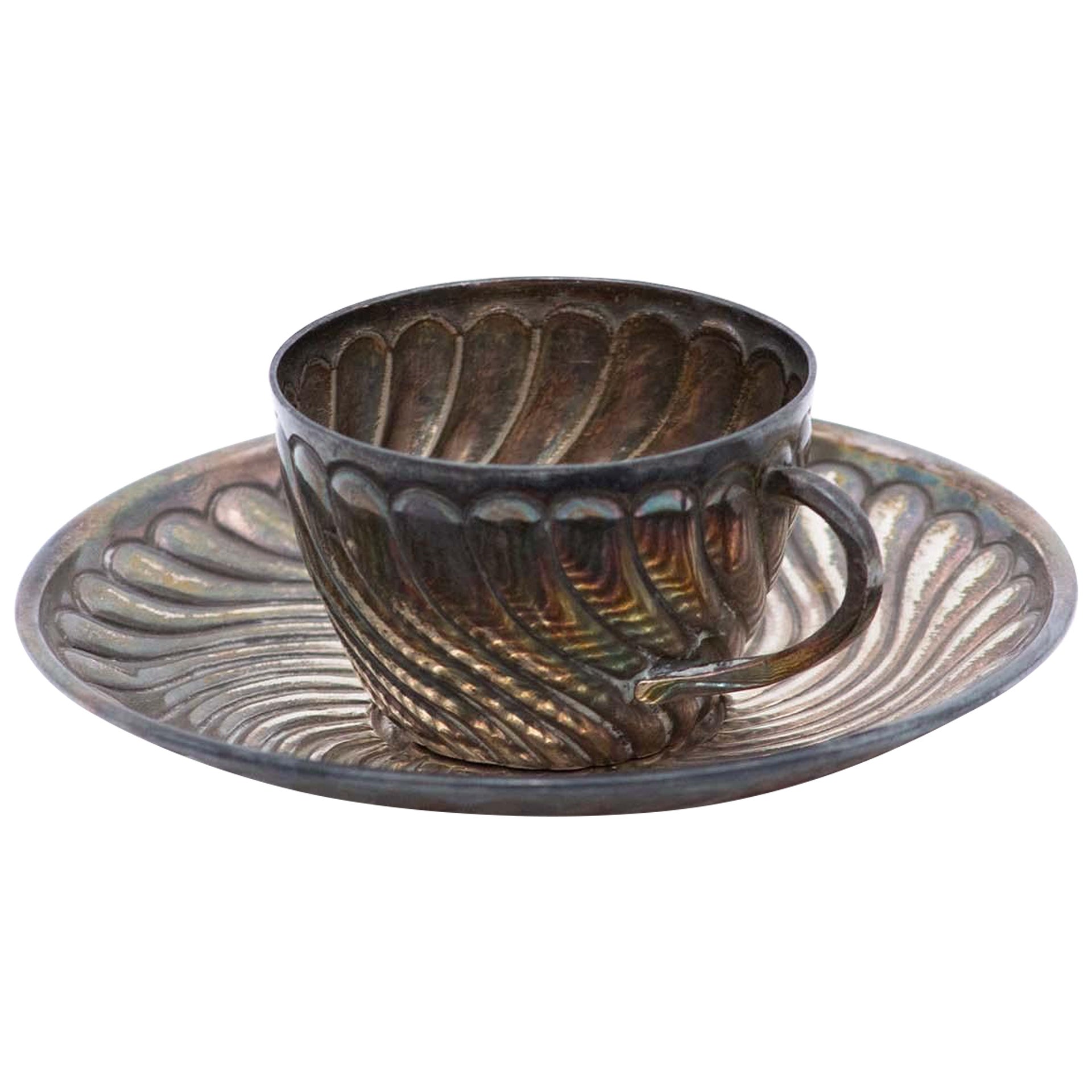 Silver coffee cup and saucer