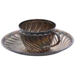 Silver coffee cup and saucer