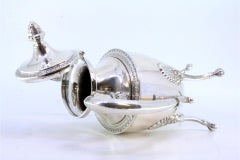 Silver coffee pot w/ reliefs & friezes, resting on four raised claw-shaped feet