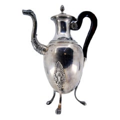 Silver coffee pot with beaded body, wood handle 
mythic spout