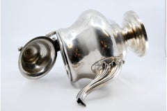 Silver coffee pot with plant engravings, monogram and raised knob lid