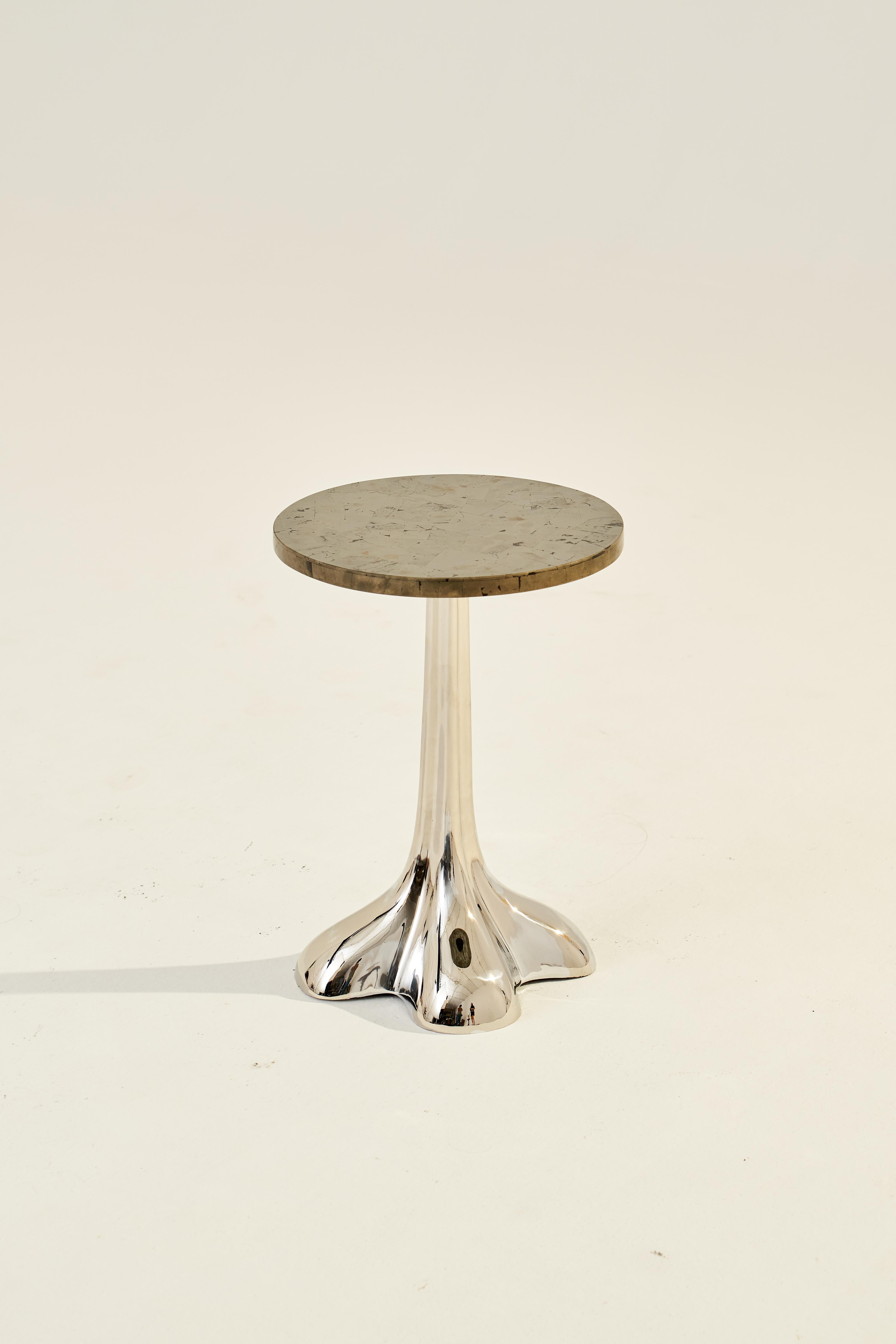 Description: Our Theia Table set is a limited edition exquisite piece of functional art that brings the allure and mystique of the precious stone into your living space. The Golden Pyrite Table, beyond its physical beauty and functionality, holds a