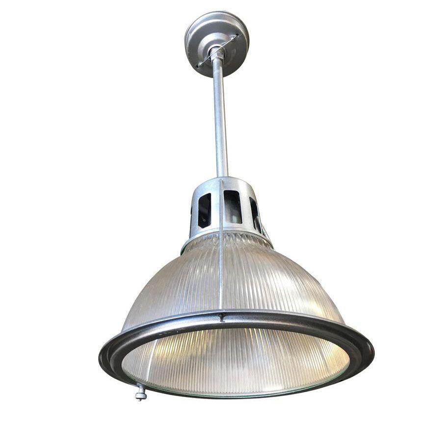 Circa 1938 very heavy made, industrial, ribbed glass Holophane Pendant lamp refinished in a bright chrome-like finish.

Available - 4

Dimension: 16