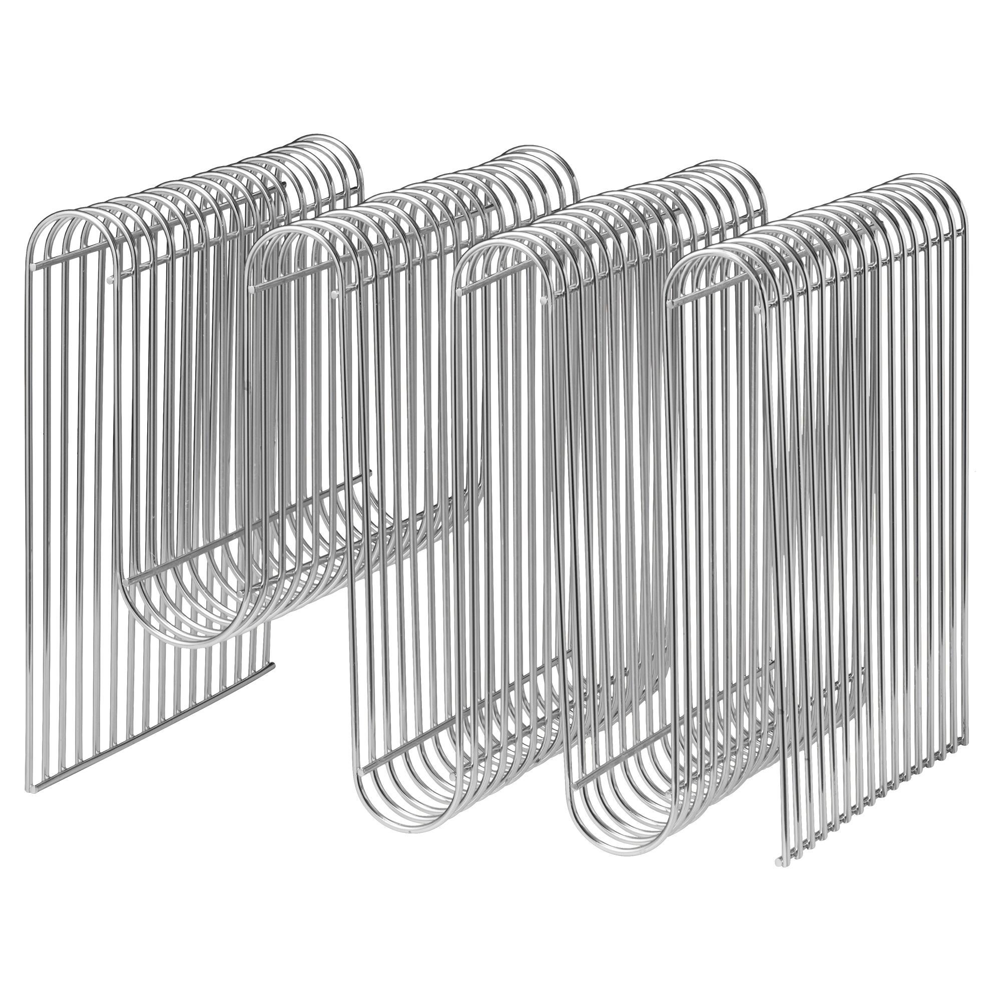 Silver contemporary magazine holder
Dimensions: L 40.5 x W 30.3 x H 30.3 cm 
Materials: Steel.
Also available in Gold and Black. 


The design of the Curva magazine holder has become an instant icon. The secret behind the success of this