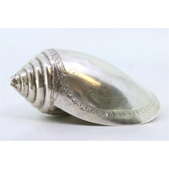 Silver cowrie shell with engraved floral motifs