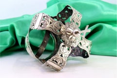 Silver crown of Virgin Mary with acanthus reliefs and cross-topped pommel