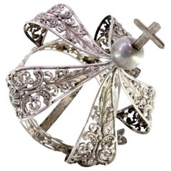 Silver crown of Virgin Mary with acanthus reliefs and cross-topped pommel