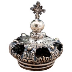 Silver crown with reliefs and applications