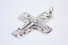 Silver crucifix with reliefs alluding to Jesus Christ